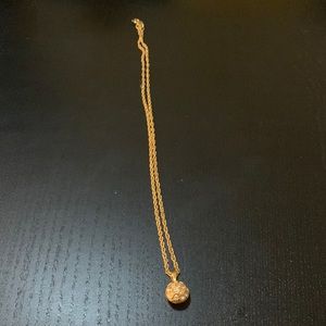 Gold necklace with rhinestone ball